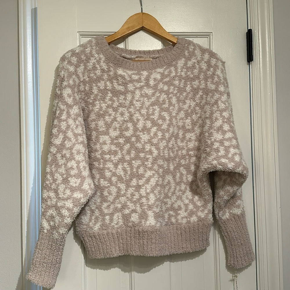 Cream colored print. Super soft cozy sweater Brand New w/style tag